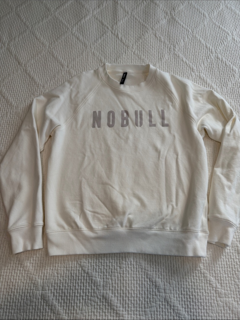 NOBULL women’s Cream Crewneck Sweatshirt with Subtle Gray Logo